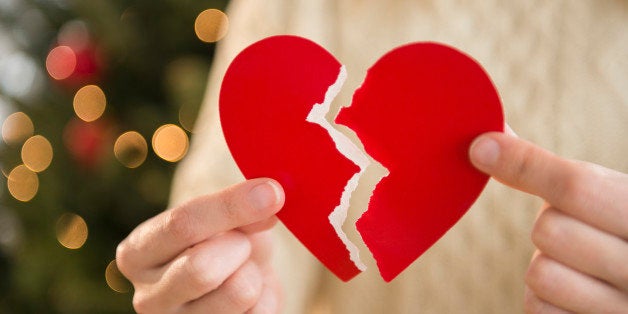 Studio Shot of female's hands holding broken heart