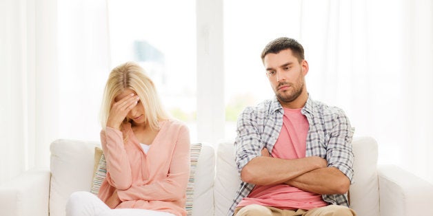 people, relationship difficulties, conflict and family concept - unhappy couple having argument at home