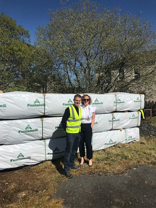 Jennie Riding and her husband Neil taking delivery of their log cabins