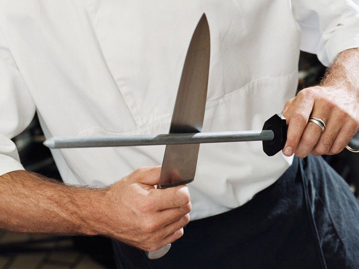 I'm new to knives. Can I sharpen this knife with a regular knife sharpener(as  seen in the pic)? Or should I take it to some one to sharpen it. I just  wanna