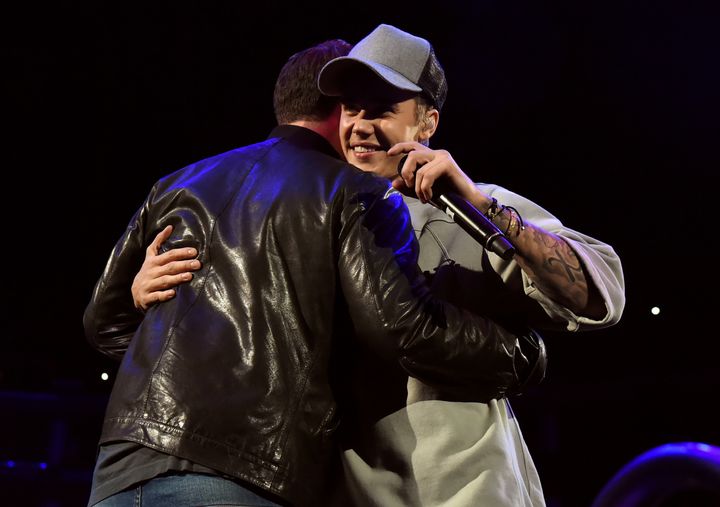 The pair share a hug on stage in 2015
