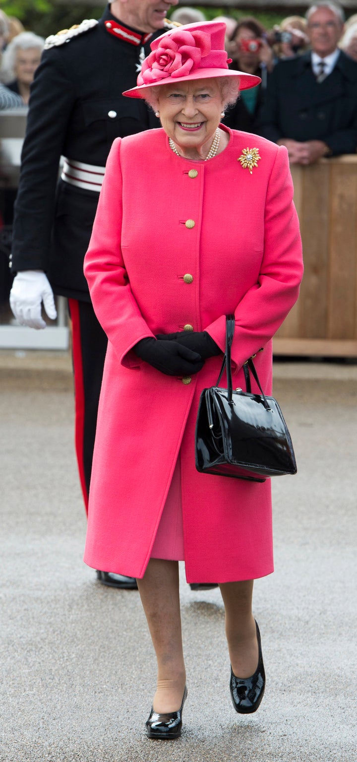 Queen Elizabeth Wore a Hot-Pink Coat and Coordinating Hat at Her Latest  Appearance