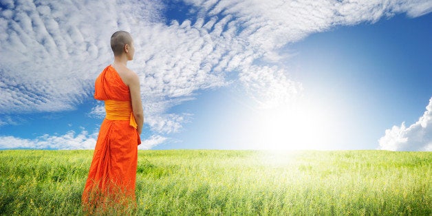 monk walk in grass fields and...