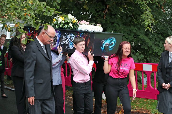 The coffins of Demi, Brandon, Lacie and Lia Pearson are carried into St Paul's Church in Walkden, ahead of their funeral