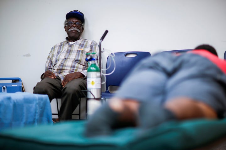 A man using a respiratory machine sits in a shelter run by the Red Cross in Grantsboro, North Carolina, on Sept. 13, 2018.