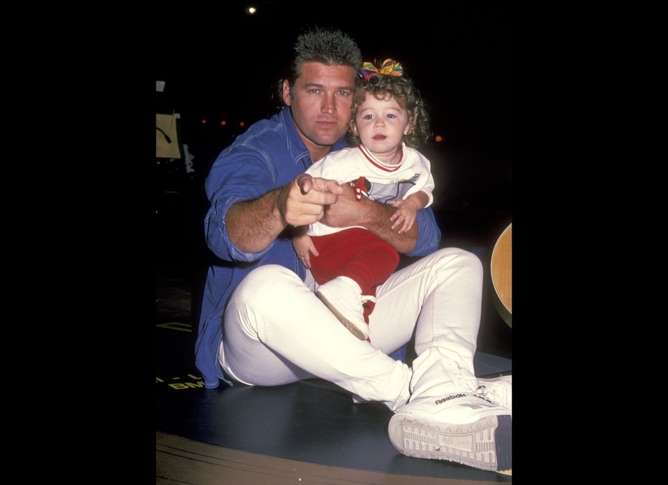With her dad Billy Ray Cyrus, 1994