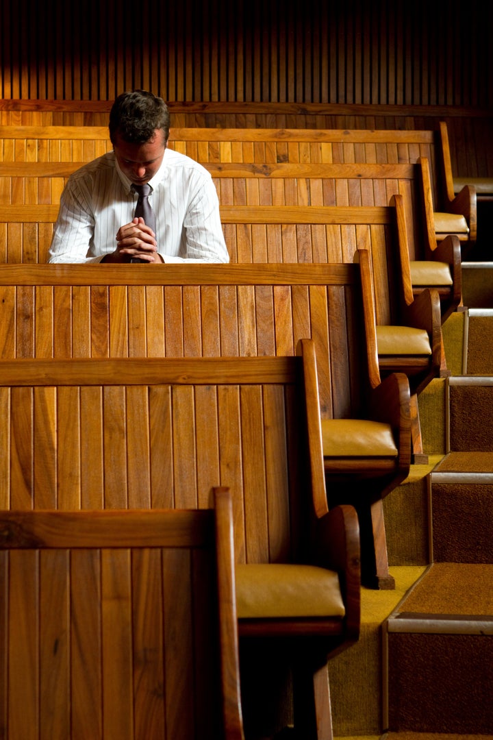 A man praying in church