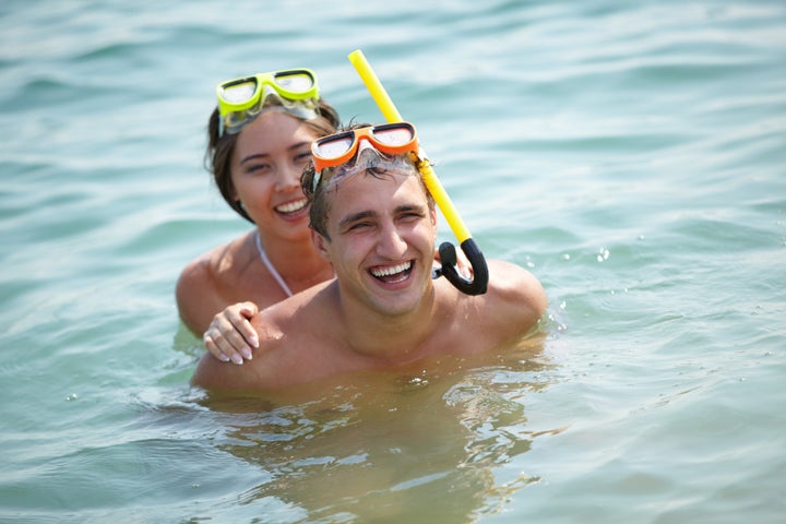 young divers in scuba masks...