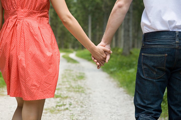 Young couple holding hands - IS360-010