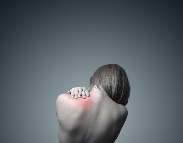 woman with pain in her neck and ...