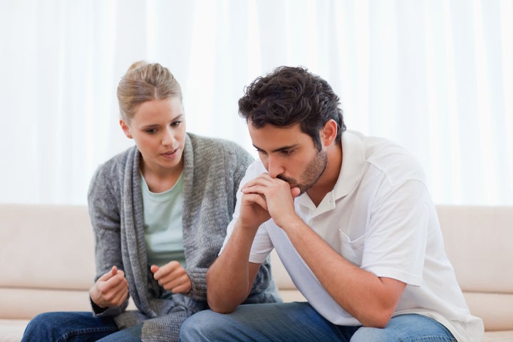 Man being mad at his fiance in their living room