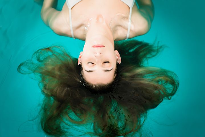 wellness young woman floating ...