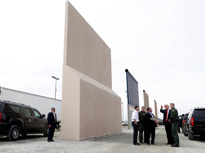 President Donald Trump inspects U.S.-Mexico border wall prototypes in San Diego on March 13. He promised hundreds of times that Mexico would pay for the wall.