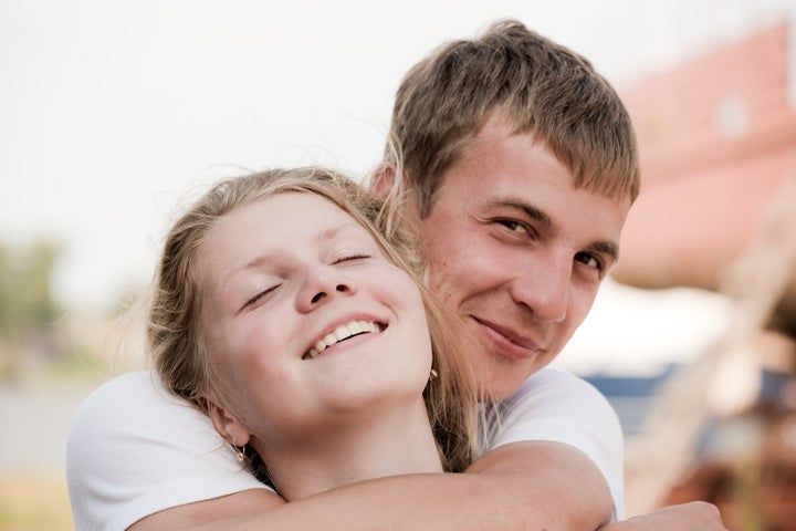 the guy embraces the girl