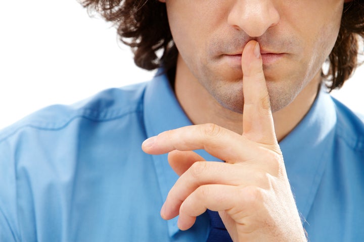 Image of gesture: male finger over lips