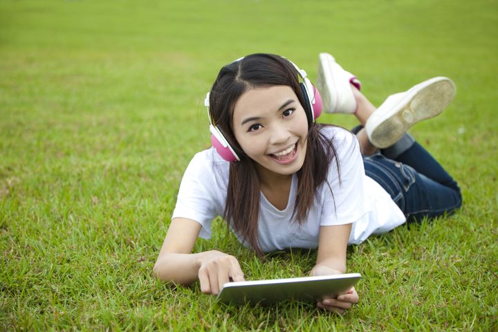 young woman using tablet pc on...