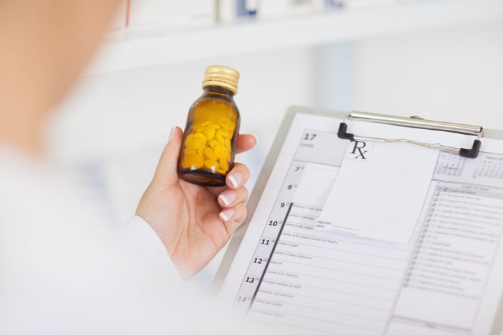 pharmacist holding a drug...