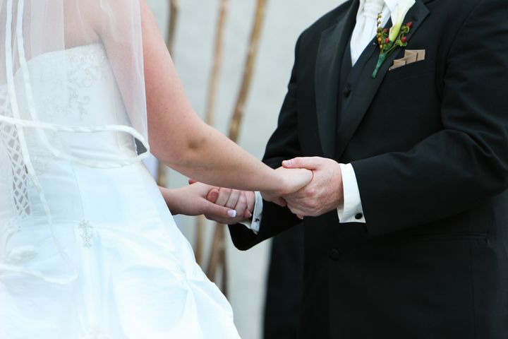 A couple exchange vows at a wedding ceremony