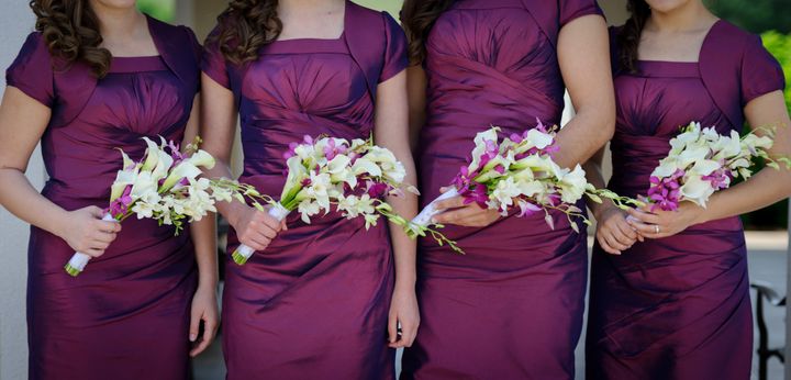 row of bridesmaids with...