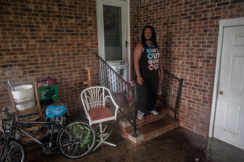 Sharon Langley returned home to gather a few belongings after being evacuated as floodwaters rose early in the morning from h