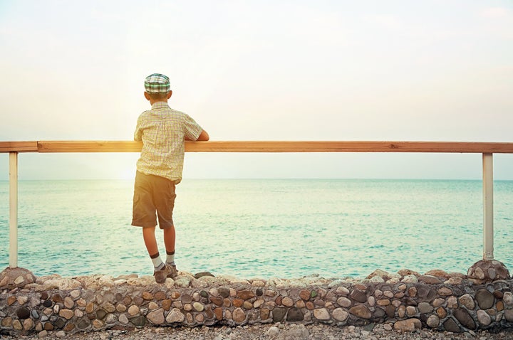 silhouette of a boy standing on ...