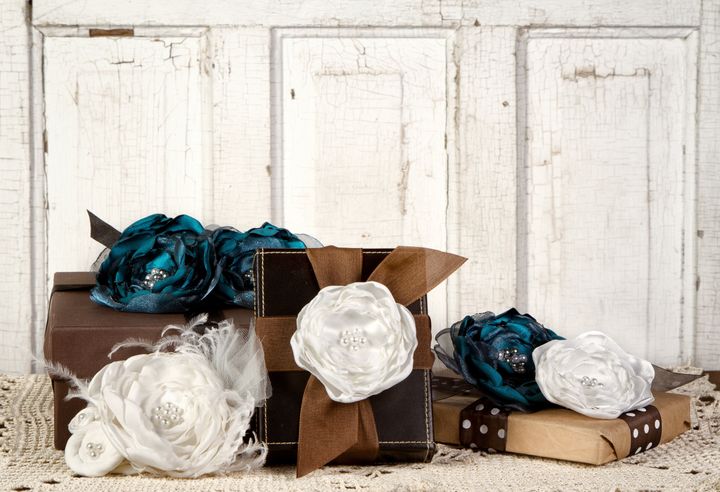 Wrapped vintage packages with vintage flowers against a vintage door