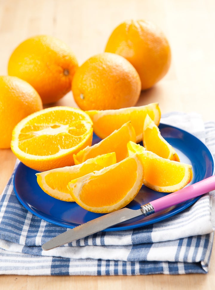 Sliced Fresh Juicy Navel Oranges on Plate