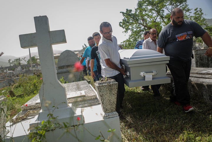 Mourners carry the coffin of Wilfredo Torres Rivera, 58, who died in October 2017 after jumping off a bridge into a lake three weeks after Hurricane Maria hit Puerto Rico. Wilfredo's family said he suffered from depression and schizophrenia and was caring for his 92-year-old mother in a home without electricity or water.