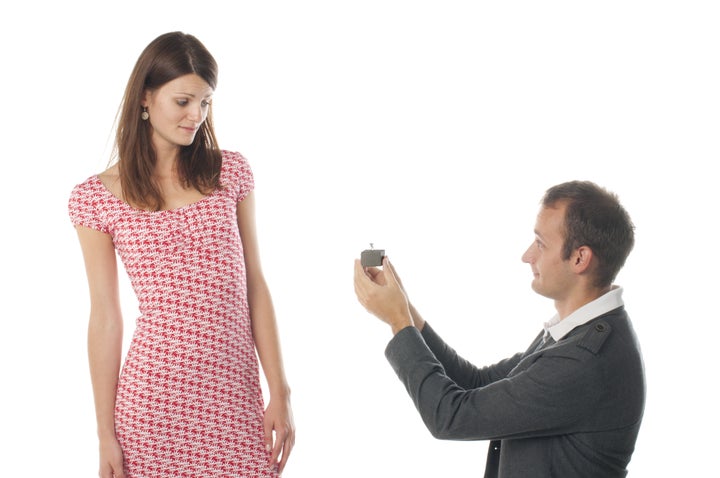 Proposal scene with sad woman and man.