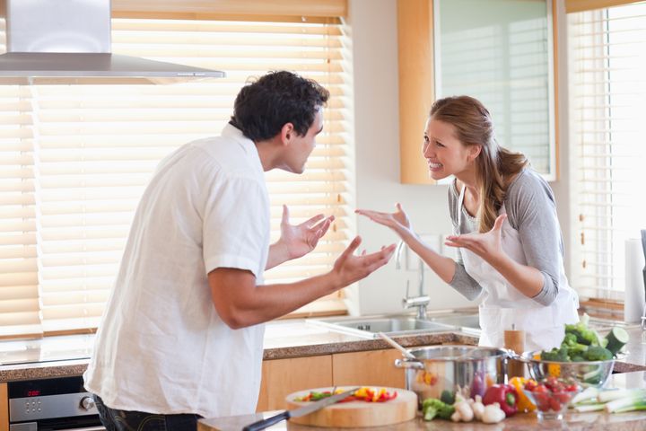 Young couple having a fight in the kitchen