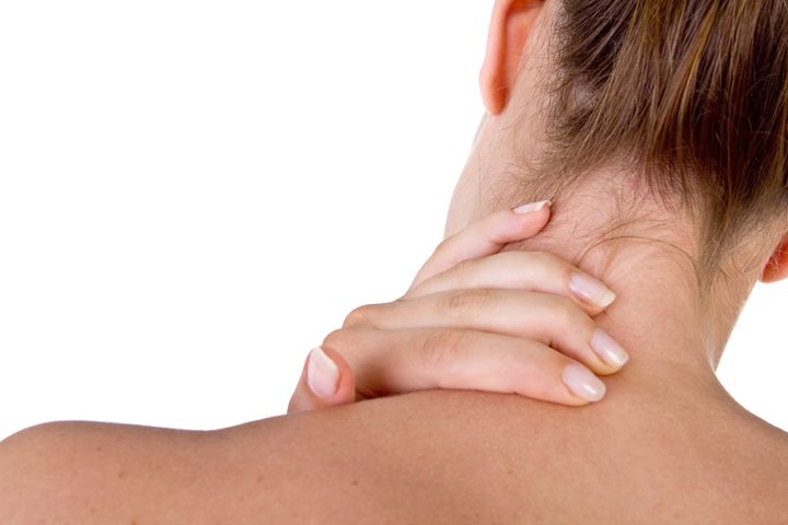 woman with pain in her neck and ...