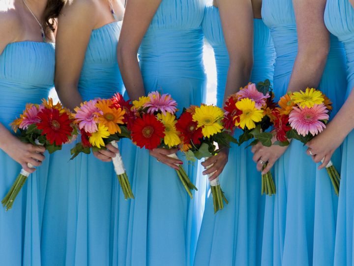 Colorful flowers and bridesmaid gowns.