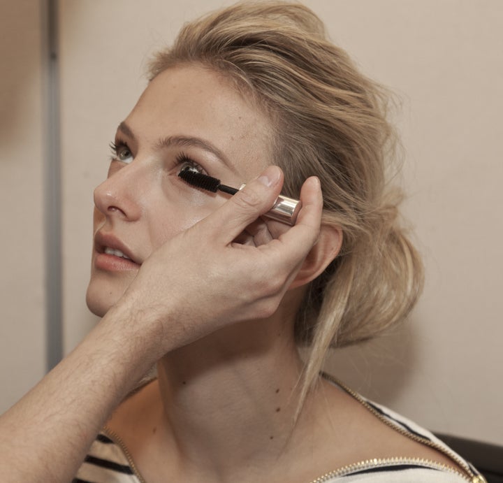 NEW YORK - OCTOBER 14: Model prepares backstage for Badgley Mischka Bride collection by Mark Badgley & James Mischka during New York Bridal fashion week at 7th Avenue showroom on Oct 14, 2012 in NYC