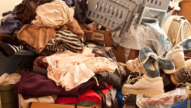 Pile of misc items stored in an unorganized fashion in a room