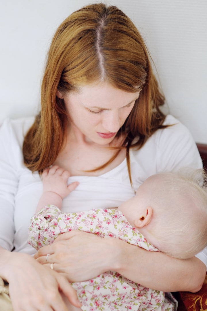 mother breastfeeding her baby...