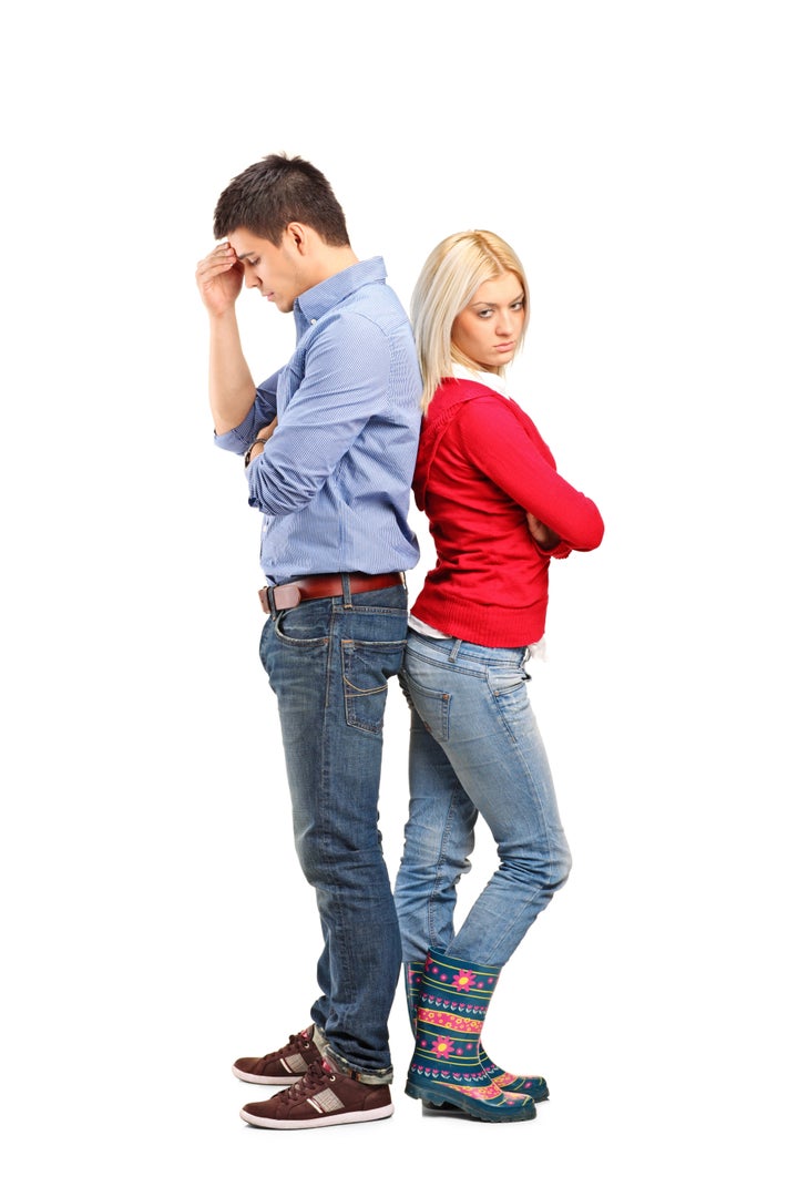 Young with their backs turned after having an argument isolated on white background