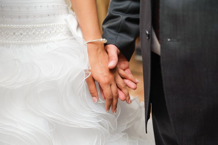 bride and groom to hold hands. togetherness couple and loving care