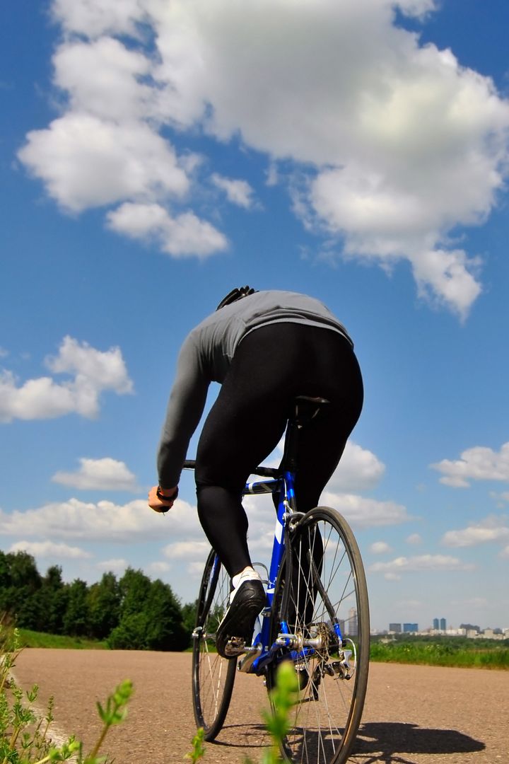 bicyclist on a background blue...