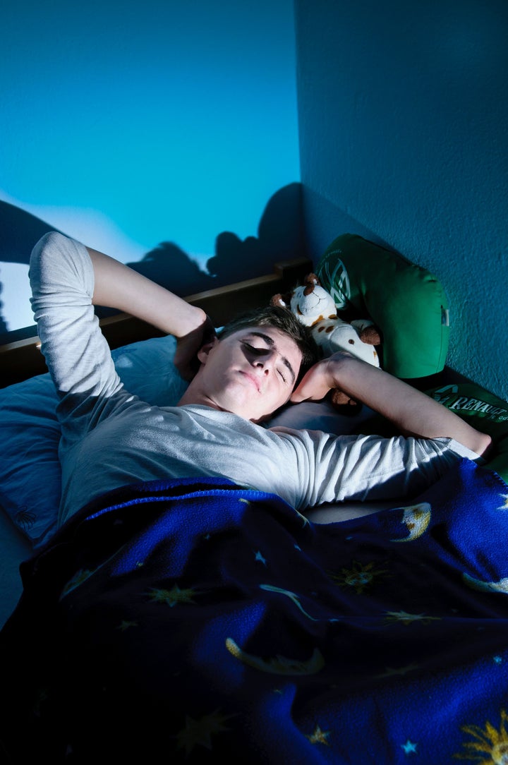 boy relaxing in bed