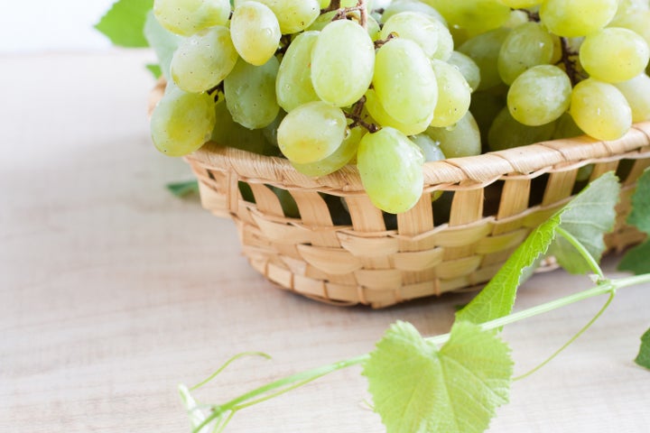 grapes in a wooden basket....