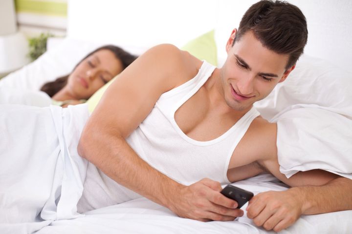 Cheating his wife, young men chatting with his mistress while his wife sleeps