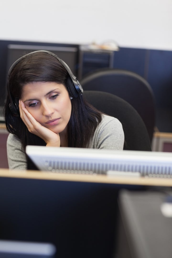 tired woman in computer room in ...