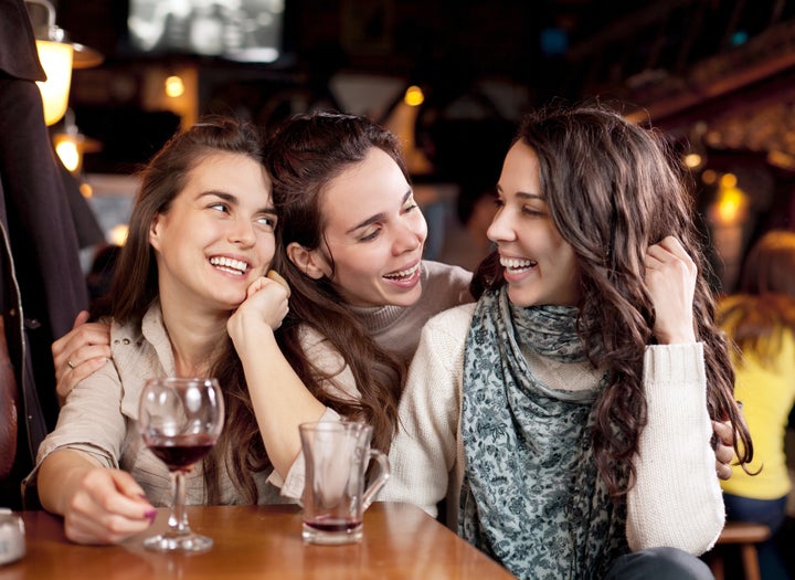 Three beautiful girls in a bar