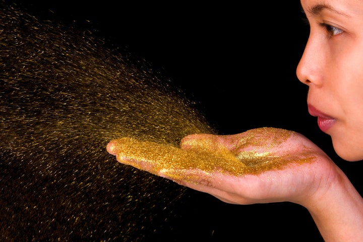 a young woman blow golden...