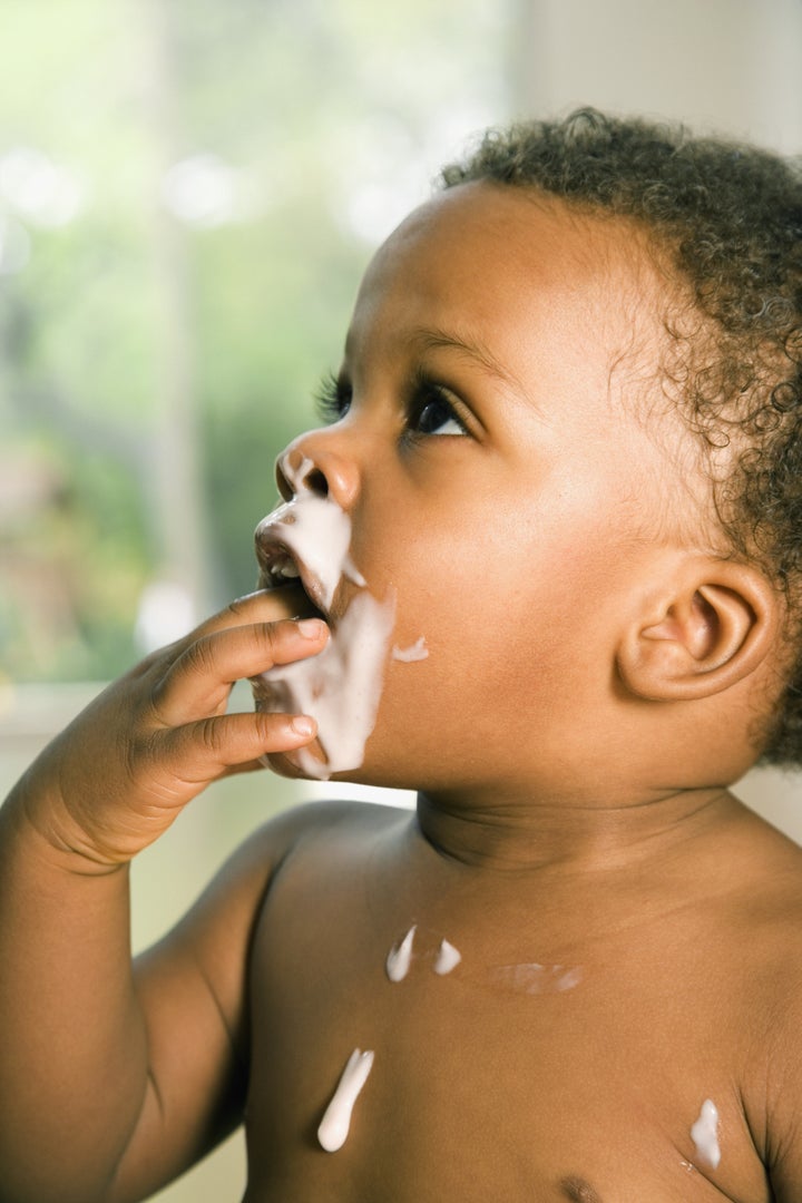 African baby playing with food