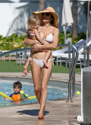 Rita Ora displays her figure in a TINY thong bikini during a beach day in  Sydney