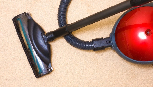 Vacuum cleaner on a carpet. Top view.