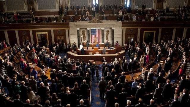 Members of the 113th US House of Representatives recite the Pledge of Allegience during the opening session at the US Capitol in Washington, DC, on January 3, 2013. AFP PHOTO / Saul LOEB (Photo credit should read SAUL LOEB/AFP/Getty Images)