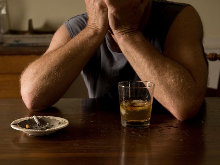 lonely and desperate - portrait of middle-aged man with addiction problems
