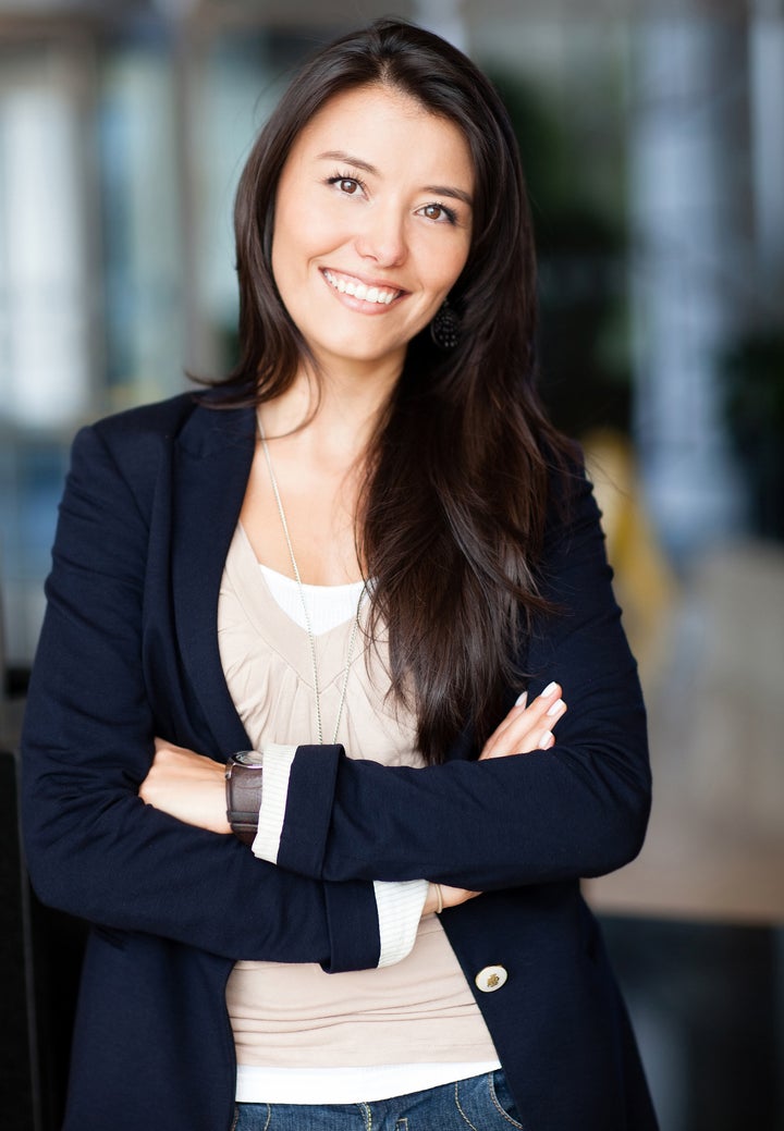 Casual business woman with arms crossed and smiling